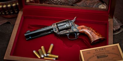 Colt SAA revolver, third generation, factory engraved and signed by Jan Gwinnell, metal finishes and custom grips by Turnbull Restoration.